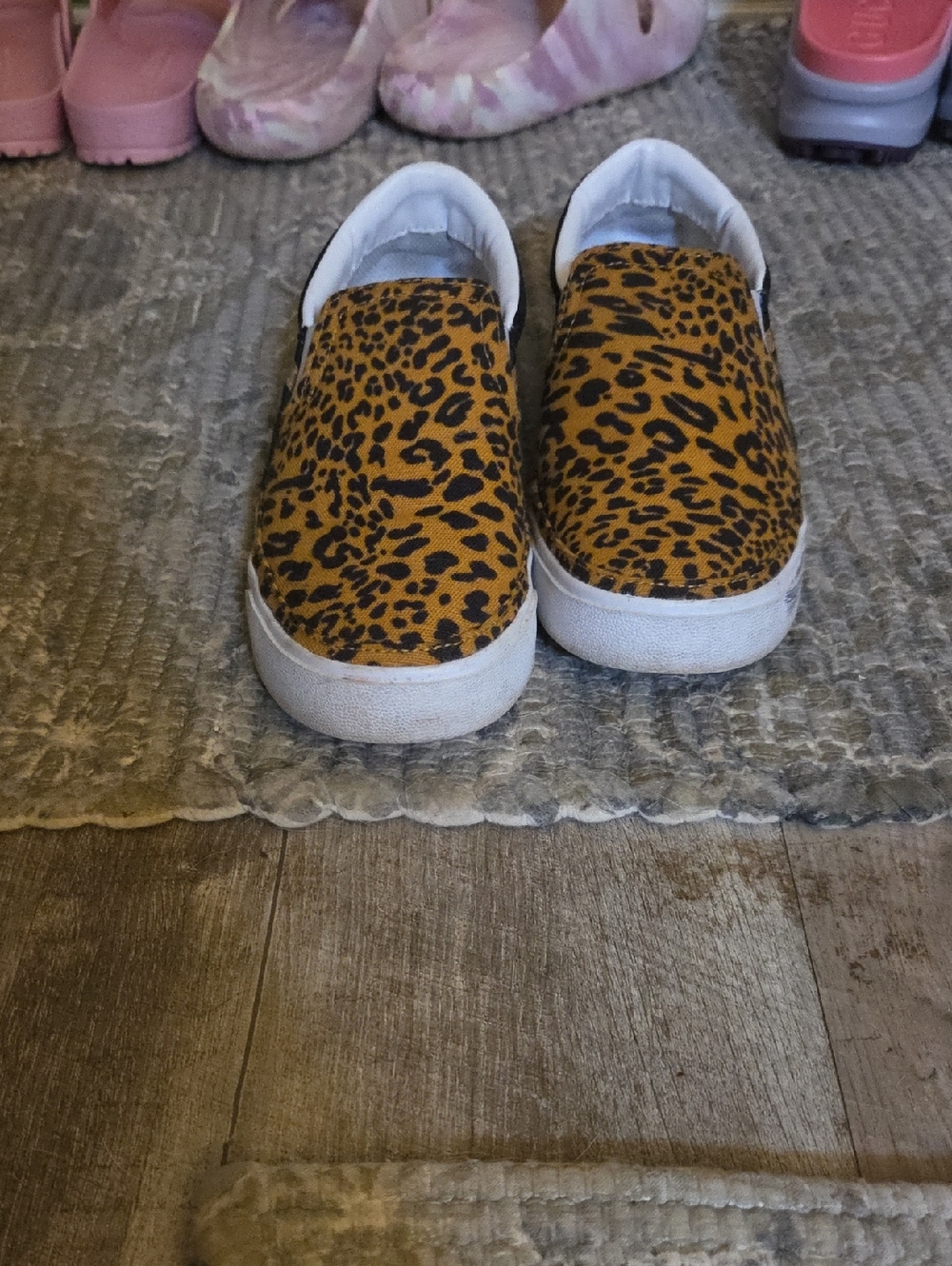 Nike Women’s Leopard Print Slip-On Sneakers in Brown and Black